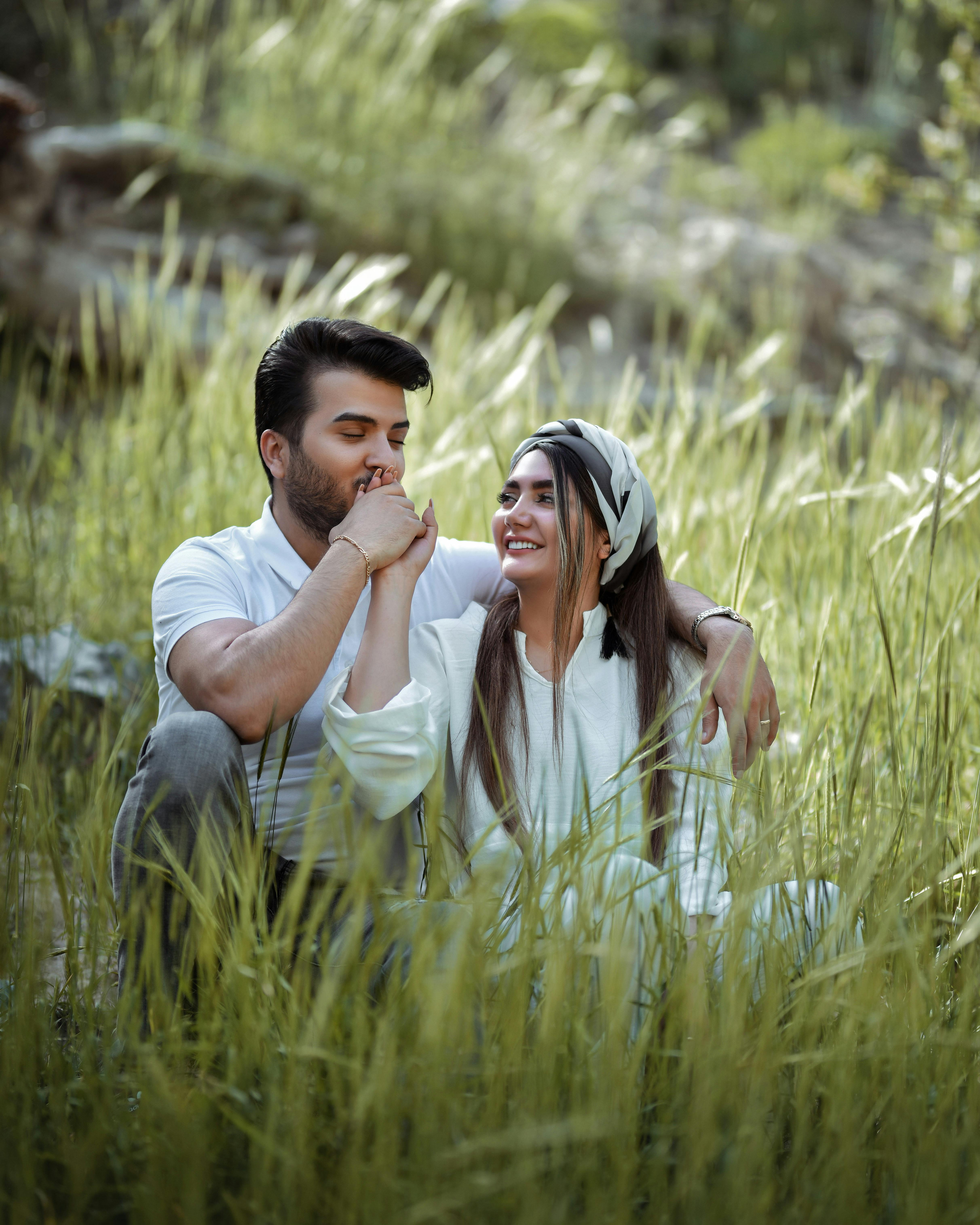 Emma and James sharing an affectionate moment together outdoors